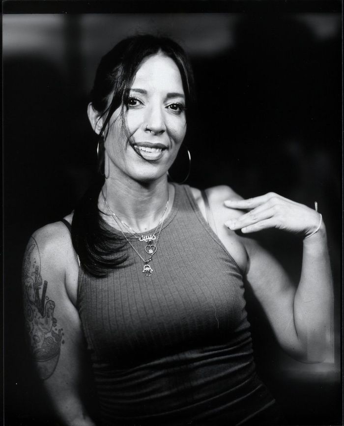Black-and-white portrait of a woman with long dark hair