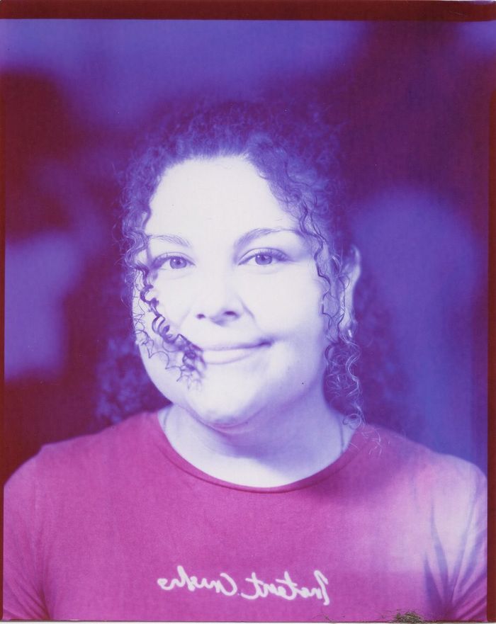 A finished color portrait of a smiling woman